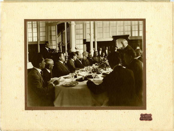  Richard Enright speaking to guests at a luncheon or dinner.